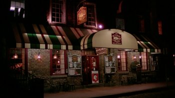 Movie still from “The Butterfly Effect 2” (2006), directed by John R. Leonetti – A building that has been lit up at night; Wide shot, High angle