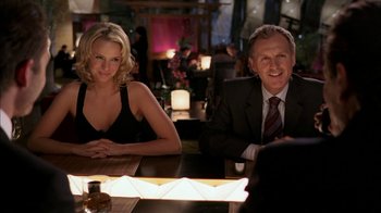 Movie still from “The Butterfly Effect 2” (2006), directed by John R. Leonetti – A man and a woman sitting at a dinner table; Medium shot, Over the shoulder angle