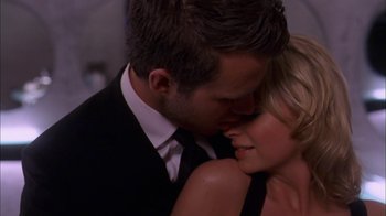 Movie still from “The Butterfly Effect 2” (2006), directed by John R. Leonetti – A person kissing another person on the cheek; Close Up shot, Over the shoulder angle