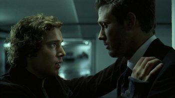 Movie still from “The Butterfly Effect 2” (2006), directed by John R. Leonetti – A man and a woman touching each other's hair; Close Up shot, Over the shoulder angle