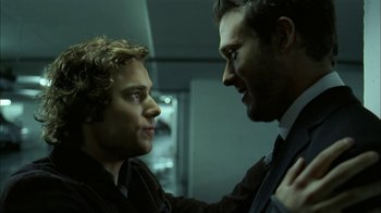 Movie still from “The Butterfly Effect 2” (2006), directed by John R. Leonetti – A man and a woman standing next to each other; Close Up shot, Over the shoulder angle