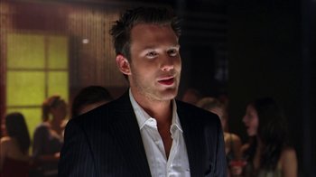 Movie still from “The Butterfly Effect 2” (2006), directed by John R. Leonetti – A person wearing a suit and tie; Close Up shot, Over the shoulder angle