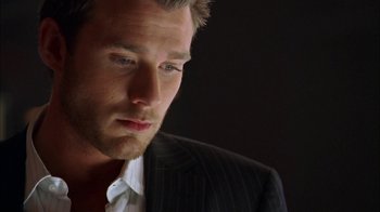 Movie still from “The Butterfly Effect 2” (2006), directed by John R. Leonetti – A person wearing a suit and tie; Close Up shot, Low angle