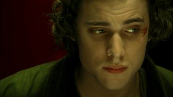 Movie still from “The Butterfly Effect 2” (2006), directed by John R. Leonetti – A man's face with green eyes; Close Up shot, Low angle