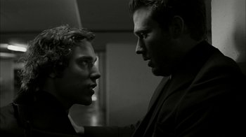 Movie still from “The Butterfly Effect 2” (2006), directed by John R. Leonetti – A man and a woman face to face in black and white; Close Up shot, Over the shoulder angle