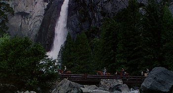 Movie still from “The Caine Mutiny” (1954), directed by Edward Dmytryk – A group of people riding horses next to a waterfall; Extreme Wide shot, High angle