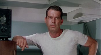 Movie still from “The Caine Mutiny” (1954), directed by Edward Dmytryk – A person wearing a white t - shirt; Close Up shot, Low angle