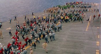 Movie still from “The Caine Mutiny” (1954), directed by Edward Dmytryk – A large group of people on a pier; Extreme Wide shot, High angle