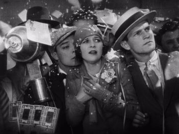 Movie still from “The Cameraman” (1928), directed by Buster Keaton – A black and white photo of a group of people; Medium shot, Low angle