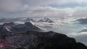 Movie still from “The Cassandra Crossing” (1976), directed by George P. Cosmatos – A view of a mountain range from a mountain top; Extreme Wide shot, High angle