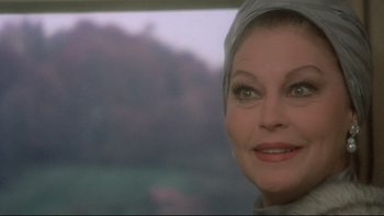 Movie still from “The Cassandra Crossing” (1976), directed by George P. Cosmatos – A person wearing a headscarf; Close Up shot, Over the shoulder angle