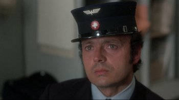 Movie still from “The Cassandra Crossing” (1976), directed by George P. Cosmatos – A person wearing a hat; Close Up shot, Low angle
