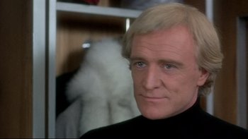 Movie still from “The Cassandra Crossing” (1976), directed by George P. Cosmatos – A person wearing a black shirt; Close Up shot, Low angle