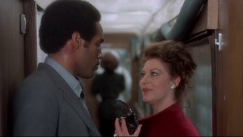 Movie still from “The Cassandra Crossing” (1976), directed by George P. Cosmatos – A man and a woman talking to each other; Close Up shot, Over the shoulder angle