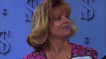 Movie still from “The Castle” (1997), directed by Rob Sitch – A person wearing a pink and purple shirt; Close Up shot, Low angle