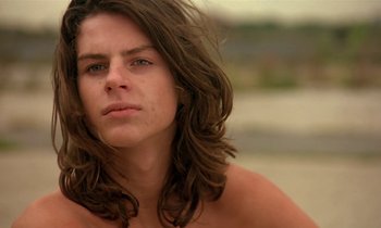 Movie still from “The Cement Garden” (1993), directed by Andrew Birkin – A person with long brown hair; Close Up shot, Low angle