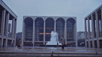 Movie still from “The Changeling” (1980), directed by Peter Medak – A group of people standing in front of a large building; Extreme Wide shot, Low angle