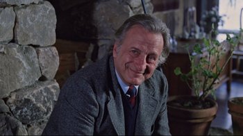 Movie still from “The Changeling” (1980), directed by Peter Medak – An older man wearing a suit and tie; Close Up shot, Low angle