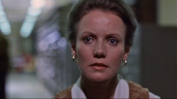 Movie still from “The Changeling” (1980), directed by Peter Medak – A person wearing a jacket; Close Up shot, Low angle