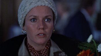 Movie still from “The Changeling” (1980), directed by Peter Medak – A person wearing a hat; Close Up shot, Over the shoulder angle