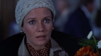 Movie still from “The Changeling” (1980), directed by Peter Medak – A person wearing a hat; Close Up shot, Over the shoulder angle