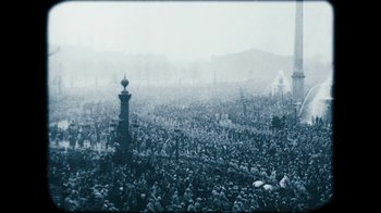 Movie still from “The Childhood of a Leader” (2015), directed by Brady Corbet – A large group of people gathered in a large crowd; Extreme Wide shot, High angle