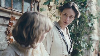 Movie still from “The Childhood of a Leader” (2015), directed by Brady Corbet – A woman and a little girl standing next to each other; Close Up shot, Over the shoulder angle