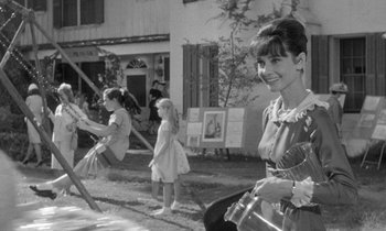 Movie still from “The Children's Hour” (1961), directed by William Wyler – A black - and - white photo of a woman and a little girl; Medium shot, Over the shoulder angle