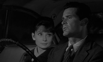 Movie still from “The Children's Hour” (1961), directed by William Wyler – A man and a woman are sitting in a car together; Close Up shot, Over the shoulder angle
