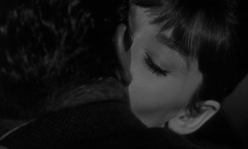 Movie still from “The Children's Hour” (1961), directed by William Wyler – A young boy's face as he kisses a cat; Extreme Close Up shot, Over the shoulder angle