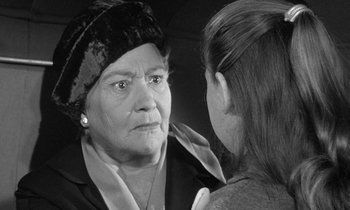 Movie still from “The Children's Hour” (1961), directed by William Wyler – An older woman looking at a younger woman; Close Up shot, Over the shoulder angle