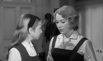 Movie still from “The Children's Hour” (1961), directed by William Wyler – A woman and a young girl looking at each other; Close Up shot, Over the shoulder angle
