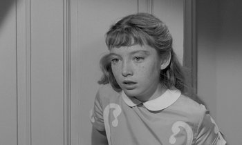 Movie still from “The Children's Hour” (1961), directed by William Wyler – A young girl is looking into the camera; Close Up shot, High angle