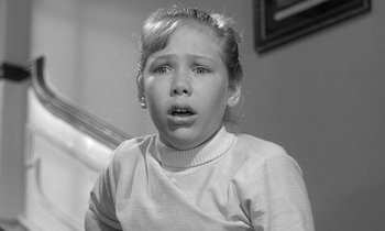 Movie still from “The Children's Hour” (1961), directed by William Wyler – A little girl is crying in a black and white photo; Close Up shot, Low angle