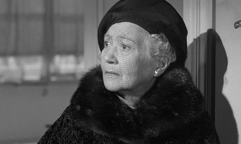 Movie still from “The Children's Hour” (1961), directed by William Wyler – An older woman wearing a fur coat and a hat; Close Up shot, Low angle