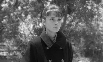 Movie still from “The Children's Hour” (1961), directed by William Wyler – Black and white photograph of a woman in a coat; Close Up shot, Low angle