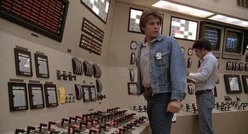 Movie still from “The China Syndrome” (1979), directed by James Bridges – A man standing in front of a control panel; Medium shot, Low angle