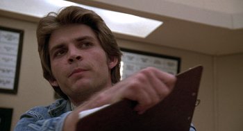 Movie still from “The China Syndrome” (1979), directed by James Bridges – A person holding a board; Close Up shot, Low angle