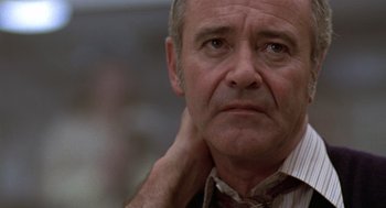 Movie still from “The China Syndrome” (1979), directed by James Bridges – An older man with a serious look on his face; Close Up shot, Low angle