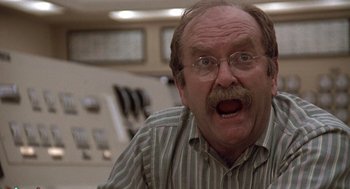 Movie still from “The China Syndrome” (1979), directed by James Bridges – An older man with a surprised look on his face; Close Up shot, Low angle