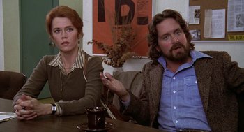 Movie still from “The China Syndrome” (1979), directed by James Bridges – A man and a woman sitting at a table; Medium shot, Over the shoulder angle