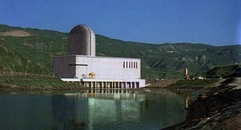 Movie still from “The China Syndrome” (1979), directed by James Bridges – A building that is sitting in the middle of a body of water; Extreme Wide shot, Low angle