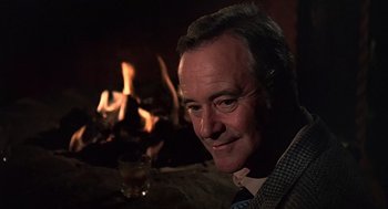 Movie still from “The China Syndrome” (1979), directed by James Bridges – A man sitting in front of a fireplace; Close Up shot, Over the shoulder angle