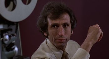 Movie still from “The China Syndrome” (1979), directed by James Bridges – A person wearing a shirt and tie; Close Up shot, Low angle
