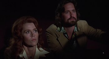 Movie still from “The China Syndrome” (1979), directed by James Bridges – A man and a woman sitting next to each other in a dark room; Close Up shot, Low angle
