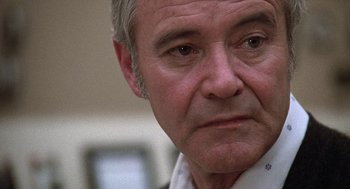 Movie still from “The China Syndrome” (1979), directed by James Bridges – An older man is looking at the camera; Close Up shot, Low angle