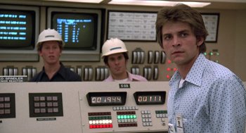 Movie still from “The China Syndrome” (1979), directed by James Bridges – A group of men standing in front of a control panel; Medium shot, Low angle
