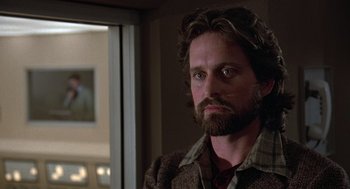 Movie still from “The China Syndrome” (1979), directed by James Bridges – A person with a beard; Close Up shot, Over the shoulder angle