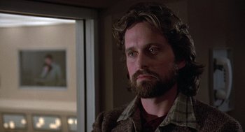 Movie still from “The China Syndrome” (1979), directed by James Bridges – A person with a beard; Close Up shot, Over the shoulder angle