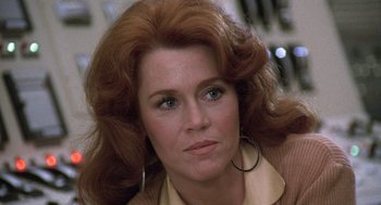 Movie still from “The China Syndrome” (1979), directed by James Bridges – A person with long red hair; Close Up shot, Low angle